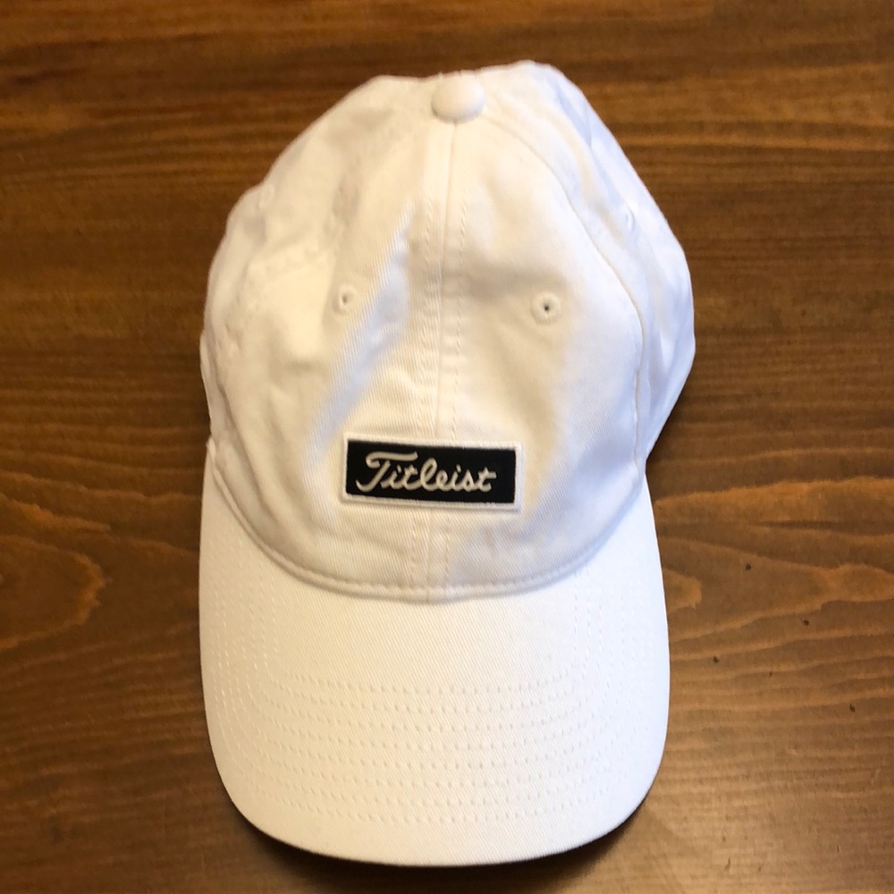 White Titleist Golf Cap with Black Logo on front. Adjustable. OS